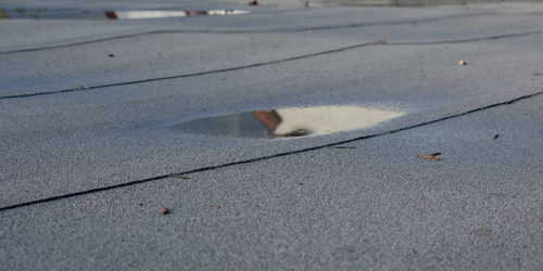 COMMON PROBLEMS WITH COMMERCIAL FLAT ROOFS